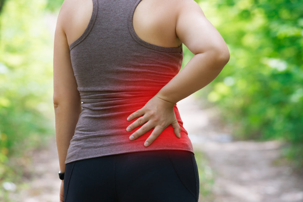 a woman having a sciatica after walking